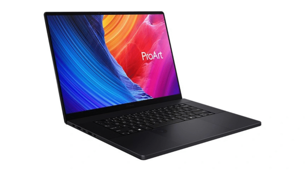 A large, black Asus ProArt laptop with thin bezels is angled to the side, displaying a vibrant wallpaper of swirling blues, yellows, and reds, with the 'ProArt' logo visible on the screen.